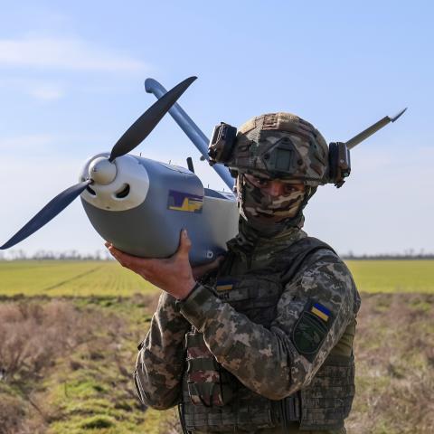 : A serviceman of the 34th Coastal Defense Brigade with the call sign ‘Shok’ holds the GOR drone, a Ukrainian reconnaissance aircraft that servicemen use to detect Russian enemy positions, at the launch point on March 14, 2025 in Kherson Oblast, Ukraine. The 34th Coastal Defense Brigade was recently formed based on the 124th Territorial Defense Brigade, which has been fighting for Kherson since the first days of the Russian full-scale invasion 2022. Over the past three years, the brigade’s units have also f