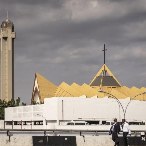 Pedestrians walk past the National Christian Church in the central business district of Abuja, Nigeria, on May 21, 2025. (Getty Images)