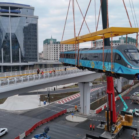 A light rail train is lifted onto the track in Astana, Kazakhstan, on October 19, 2025. (Getty Images)