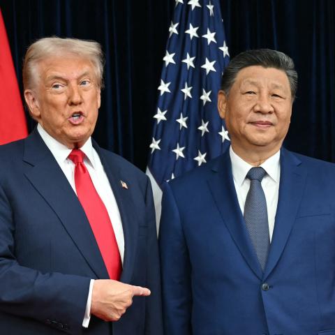 US President Donald Trump (L) and China's President Xi Jinping greet each other as they arrive for talks at the Gimhae Air Base, located next to the Gimhae International Airport in Busan on October 30, 2025. Donald Trump and Chinese leader Xi Jinping will seek a truce in their bruising trade war on October 30, with the US president predicting a "great meeting" but Beijing being more circumspect. (Photo by ANDREW CABALLERO-REYNOLDS / AFP) (Photo by ANDREW CABALLERO-REYNOLDS/AFP via Getty Images)