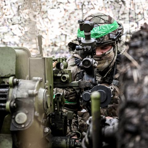 A soldier from an artillery crew of the Striletskyi special forces police battalion of the Main Department of the National Police in Zaporizhzhia region aims a 122-mm howitzer D-30 to fire at the positions of Russian troops in the Pokrovsk direction in Donetsk region, Ukraine, on November 20, 2025. (Photo by Dmytro Smolienko/Ukrinform/NurPhoto via Getty Images) NO USE RUSSIA. NO USE BELARUS.
