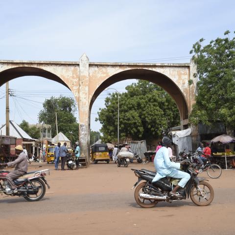 Motor bike riders drive past Kofar Kade, a city gate in ancient Sokoto, Nigeria, on September 21, 2021. (Getty Images)