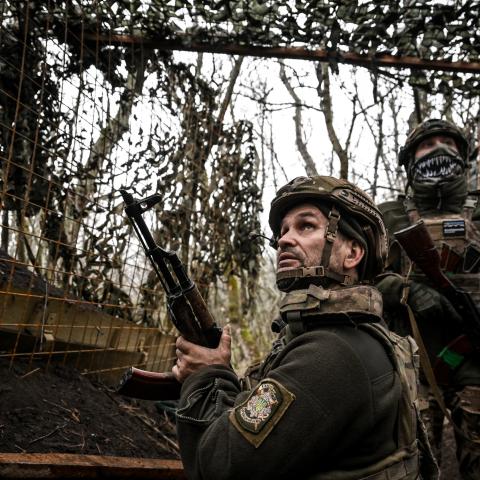 Soldiers from an artillery unit watch a drone flying above the caponier of their artillery weapon during a combat mission in the Pokrovsk direction in the Donetsk region, Ukraine, on December 11, 2025. (Getty Images)