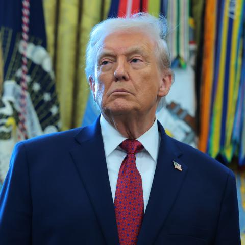 President Donald Trump listens during a ceremony in the Oval Office of the White House on December 15, 2025, in Washington, DC. (Getty Images)