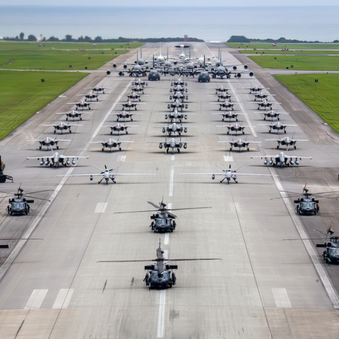 Edited version of US Air Force, US Navy, and US Marine Corps aircraft along with US Army Patriot missile batteries line up on the runway for an elephant walk during a routine operational readiness