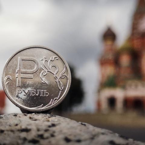 A Russian ruble coin is pictured in front of the Kremlin in Moscow on September 12, 2025. (Getty Images)