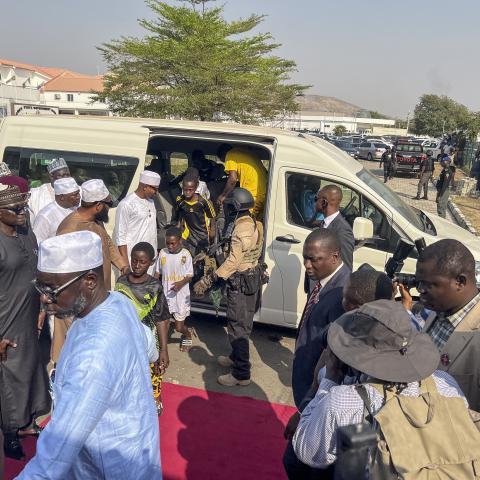 Children who were released after being kidnapped get out of a minibus upon their arrival at the Niger State Government House in Minna, Nigeria, on December 22, 2025. (Getty Images)