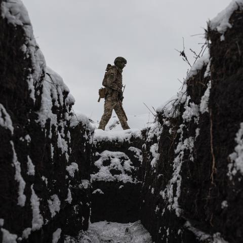 A Ukrainian soldier walks around a snow-covered training ground in Kharkiv Oblast in Ukraine on December 27, 2025. (Getty Images)