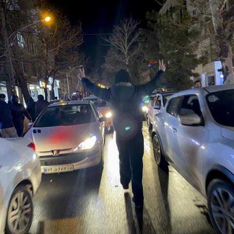 A protester flashes victory signs as traffic slows during demonstrations in Hamedan, Iran, on January 1, 2026. The demonstrations erupted after shopkeepers in Tehran’s Grand Bazaar shut their businesses to protest the sharp fall of Iran’s currency and worsening economic conditions. (Getty Images)
