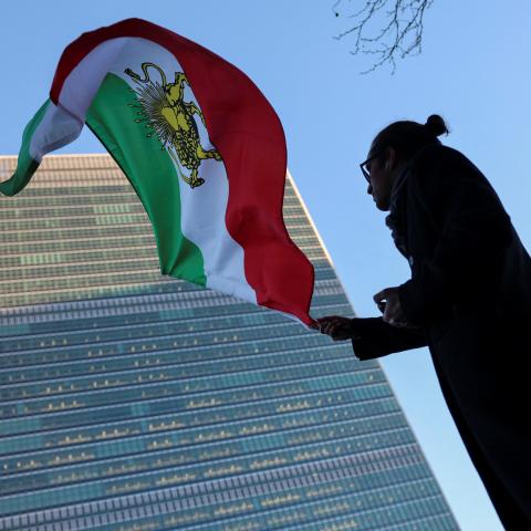 A protester waves the pre-Islamic Revolution Iranian flag outside UN headquarters during a United Nations Security Council meeting on Iran in New York on January 15, 2026. (Getty Images)