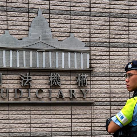 A police officer stands near the West Kowloon court where Hong Kong media mogul Jimmy Lai’s national security trial took place on August 28, 2025. (Getty Images)
