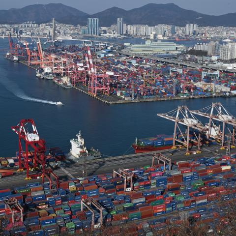 Containers are stacked on ships at a terminal in the port of Busan, South Korea, on February 18, 2026. (Getty Images)