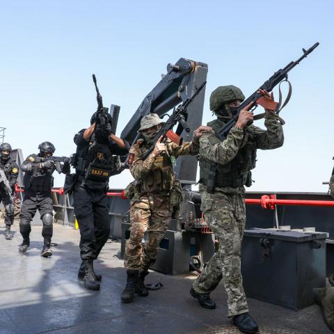 Caption Naval units from Iran and Russia carry out joint naval drills at the Port of Bandar Abbas near the Strait of Hormuz in Hormozgan, Iran, on February 19, 2026. (Getty Images) Share to Twitter