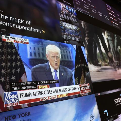 A press conference by President Donald Trump on tariffs is displayed on a television at the New York Stock Exchange on February 20, 2026. (Getty Images)