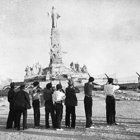  A Communist firing squad aiming at the colossal Monument of the Sacred Heart during the Spanish Civil War, 1936