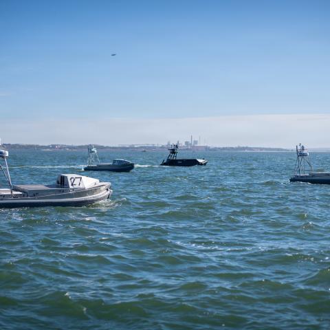 Unmanned surface vessels supported by Naval Surface Warfare Center, Port Hueneme Division (NSWC PHD) prepare for a NATO exercise offshore from the Portuguese Navy Operational Experimentation Center in Troia, Portugal, during the 2025 Robotic Experimentation and Prototyping with Maritime Unmanned Systems exercise, known as REPMUS, on Sept. 24. (U.S. Navy photo by Eric Parsons)