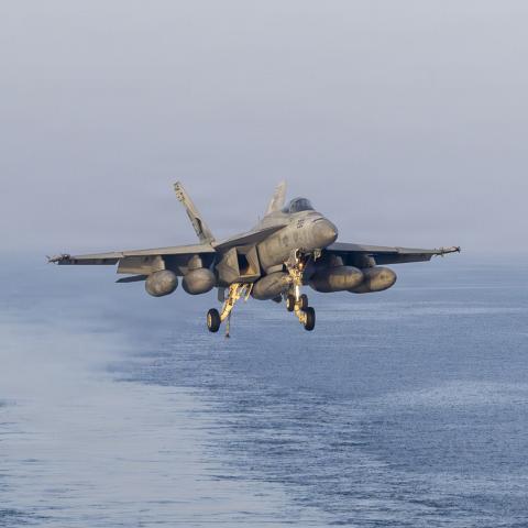 A U.S. Navy F/A-18E Super Hornet, attached to Strike Fighter Squadron (VFA) 14, prepares to make an arrested landing on the flight deck of Nimitz-class aircraft carrier USS Abraham Lincoln (CVN 72) in support of Operation Epic Fury, March 16, 2026. (U.S. Navy photo)