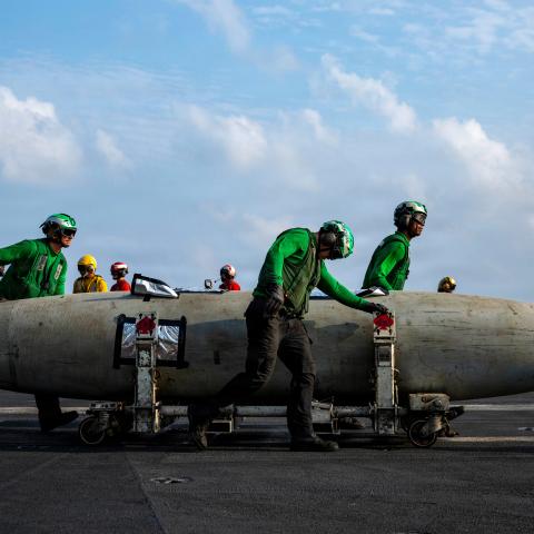 U.S. Sailors transport a fuel tank on the flight deck of Nimitz-class aircraft carrier USS Abraham Lincoln (CVN 72) during Operation Epic Fury, March 21, 2026. (U.S. Navy photo)