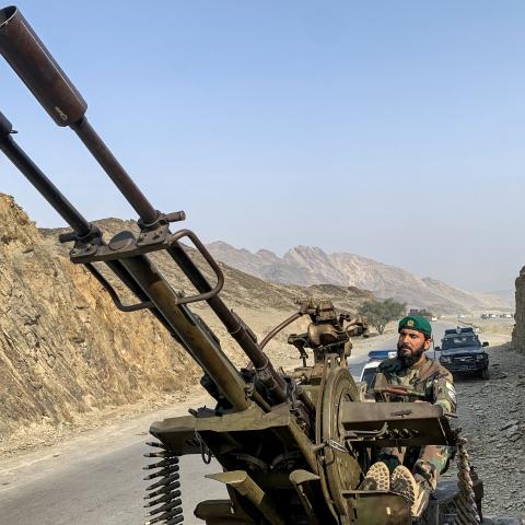 A Taliban security personnel operates an anti-aircraft gun near the Torkham border crossing between Afghanistan and Pakistan on February 27, 2026. (Getty Images)