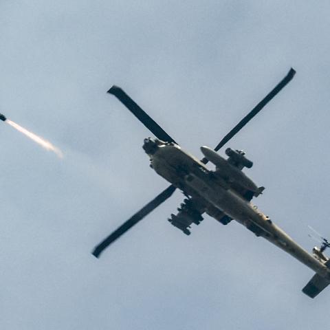 An Israeli Air Force AH-64 Apache attack helicopter fires rockets on March 18, 2026. (Getty Images)