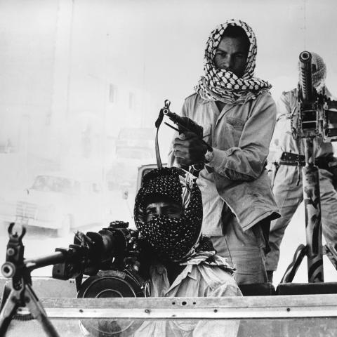 Palestinian guerillas patrol the streets of Amman in a heavily armed jeep. (Getty Images)