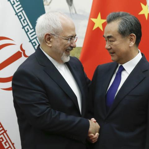 Caption Chinese State Councillor and Foreign Minister Wang Yi meets Iran’s Foreign Minister Mohammad Javad Zarif at the Diaoyutai state guesthouse in Beijing on May 13, 2018. (Getty Images) 
