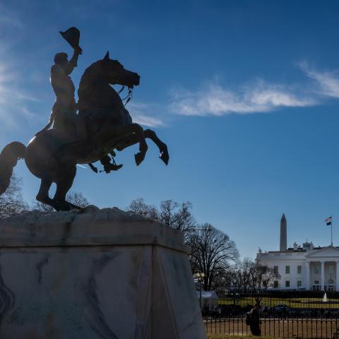 The low winter sun shines on the White House and the bronze equestrian statue of Andrew Jackson in Lafayette Square on January 12, 2026. (Getty Images)