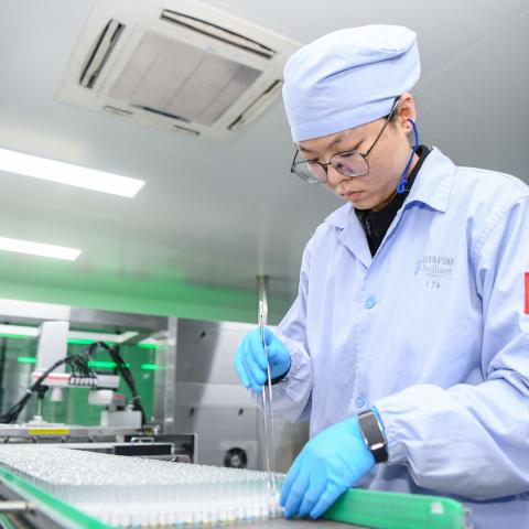 An employee works at the workshop of Hainan Brilliant Pharmaceutical Co., Ltd. on January 7, 2026 in Haikou, Hainan Province of China. (Photo by Su Bikun/VCG via Getty Images)