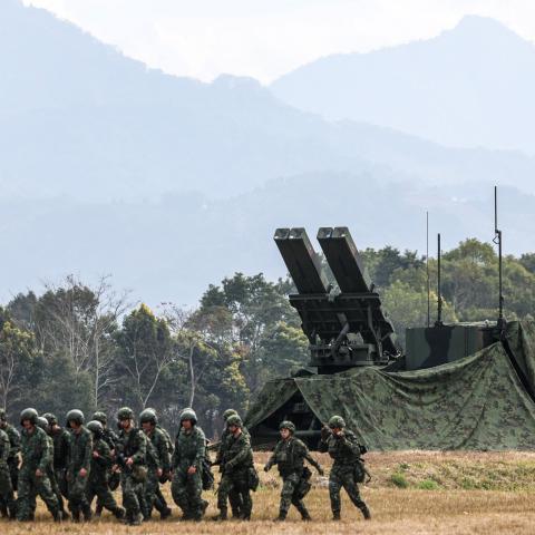 Taiwanese soldiers walk past a Sky Sword II Land-based Air Defence Missile in Taichung on January 27, 2026. (Photo by I-Hwa Cheng / AFP via Getty Images)