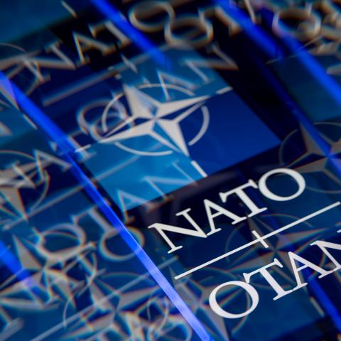 The logo of the North Atlantic Treaty Organization (NATO/OTAN) is displayed on a smartphone screen. (Getty Images)