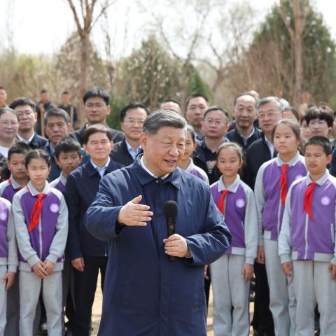 Chinese President Xi Jinping, also general secretary of the Communist Party of China Central Committee and chairman of the Central Military Commission, talks with the crowd on site during a voluntary tree-planting activity at Baishan Town in Changping District of Beijing, capital of China, March 30, 2026. Xi and other Party and state leaders, including Li Qiang, Zhao Leji, Wang Huning, Cai Qi, Ding Xuexiang, and Li Xi, took part in a voluntary tree-planting activity in Changping District of Beijing on Monda