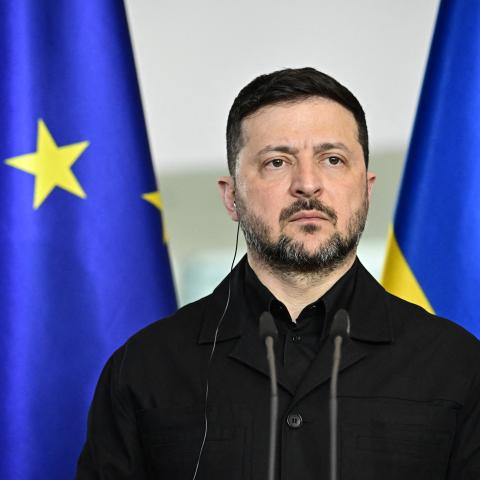 Ukrainian President Volodymyr Zelensky attends a joint press conference with the German Chancellor at the Chancellery in Berlin on April 14, 2026 during German-Ukrainian government consultations. The meeting comes as US-initiated peace talks between Russia and Ukraine have stalled, with Kyiv baulking at the idea it could cede territory to Russia. (Photo by Tobias SCHWARZ / AFP via Getty Images)