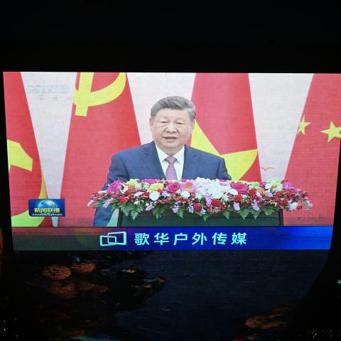 News footage on a giant screen outside a shopping mall in Beijing shows China's President Xi Jinping speaking during an event with General Secretary of the Communist Party of Vietnam and Vietnam's President To Lam on April 15, 2026. (Photo by Pedro PARDO / AFP via Getty Images)