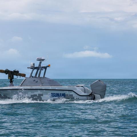An unmanned surface vehicle (USV) sails off the coast of Key West, Fla., during the annual Fleet Experimentation (FLEX) 2026 event, April 24, 2026. Hosted by U.S. Naval Forces Southern Command/U.S. 4th Fleet April 24-30, the exercise integrates commercially developed unmanned systems and artificial intelligence with traditional manned naval platforms. FLEX 2026 features comprehensive collaboration across the Department of War and industry to demonstrate a sophisticated kill chain that successfully found, tr