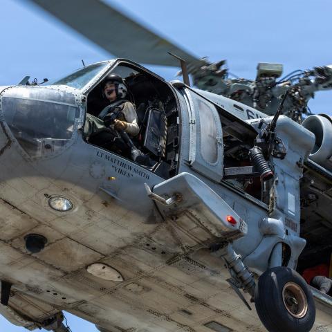 U.S. Navy MH-60 Sea Hawk helicopters are supporting Project Freedom in and near the Strait of Hormuz. Earlier today, Sea Hawk and U.S. Army AH-64 Apache helicopters were used to eliminate Iranian small boats threatening commercial shipping. (U.S. Navy Photo)