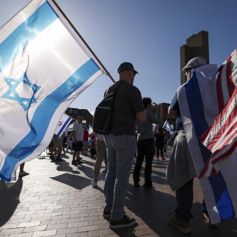 People carry Israeli and American flags during the United for Israel march, led by the Pursuit NW Christian Church, on the University of Washington campus in Seattle, Washington, on May 12, 2024. (Getty Images)