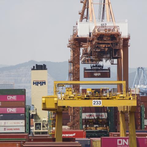 A cargo ship loads and unloads foreign trade containers at Busan Newport in Busan, South Korea, on July 23, 2025. (Getty Images) Share to Twitter