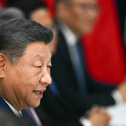 China's President Xi Jinping speaks during talks with US President Donald Trump at the Gimhae Air Base, in Busan on October 30, 2025. (Getty Images)
