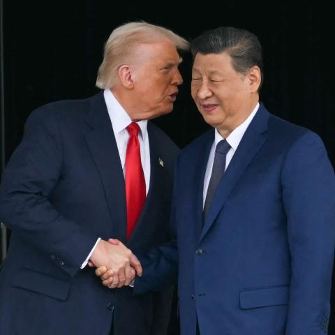  US President Donald Trump (L) and China's President Xi Jinping shake hands as they leave after their talks at the Gimhae Air Base, located next to the Gimhae International Airport in Busan on October 30, 2025. US President Donald Trump and China's leader Xi Jinping opened on October 30 their first face-to-face meeting in six years, seeking a truce to end a trade war that has roiled the world economy. (Photo by ANDREW CABALLERO-REYNOLDS / AFP via Getty Images)