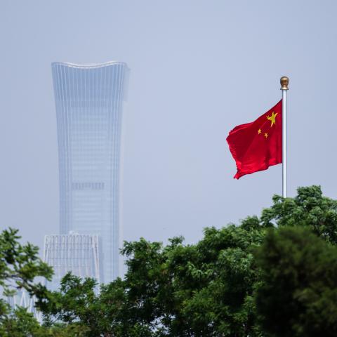 China's national flag flutters in the wind next to the CITIC tower on May 12, 2026, in Beijing, China. (Getty Images)
