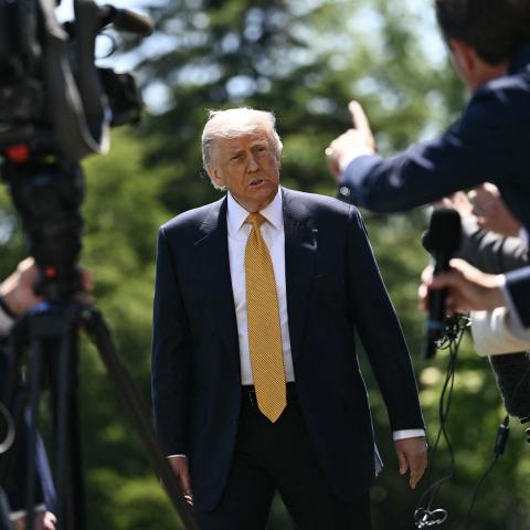 Caption US President Donald Trump speaks to the press on the South Lawn of the White House in Washington, DC, on May 12, 2026. (Getty Images)