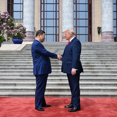 Caption President Donald Trump is greeted by Chinese President Xi Jinping at the Great Hall of the People on May 14, 2026, in Beijing, China. (Getty Images) Share to Twitter