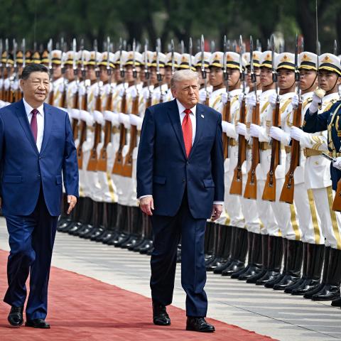 President Donald Trump and Xi Jinping inspect a guard of honour during a welcome ceremony at the Great Hall of the People in Beijing on May 14, 2026. (Getty Images) Share to Twitter