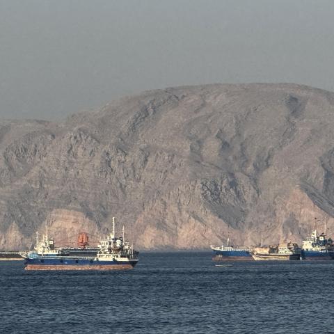 Vessels are seen anchored in the Strait of Hormuz off the port city of Khasab, Oman, on May 17, 2026. (Getty Images)