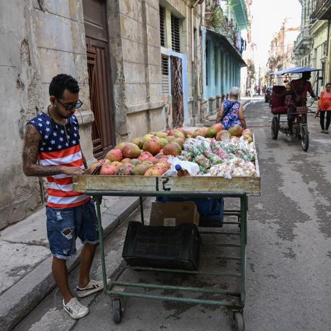 A street vendor wearing a T-shirt bearing a US flag waits for customers on a street in Havana on May 18, 2026. (Getty Images)