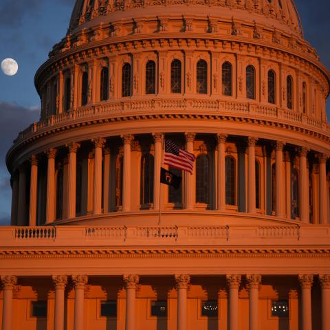 The moon is visible behind the US Capitol on December 2, 2025, in Washington, DC. (Getty Images) Share to Twitter