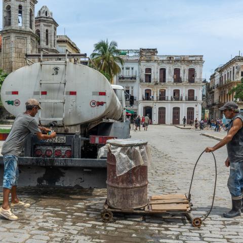 Residents collect water from tanker trucks and carry containers through the streets amid widespread shortages, as seen in Havana, Cuba, on June 4, 2026. (Getty Images)