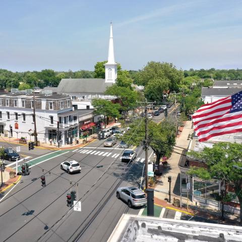 An aerial view of an intersection in downtown Babylon Village, New York, with the steeple of the First Presbyterian Church in the background, on June 26, 2024. (Getty Images)