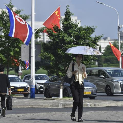 The national flags of North Korea and China are displayed on a street in Pyongyang on June 8, 2026, as Xi Jinping arrives for his first official visit to North Korea since 2019. (Getty Images)