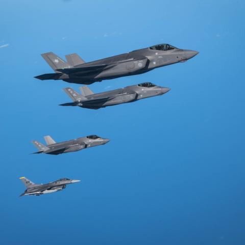 A Japan Air Self-Defense Force F-35A Lightning II flies alongside two F-35A Lightning IIs and an F-16 Fighting Falcon of the US Air Force over the Pacific Ocean near Misawa Air Base in Japan on September 30, 2025. (US Air Force)